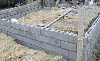 Professionals building a foundation with blocks in Spokane, WA